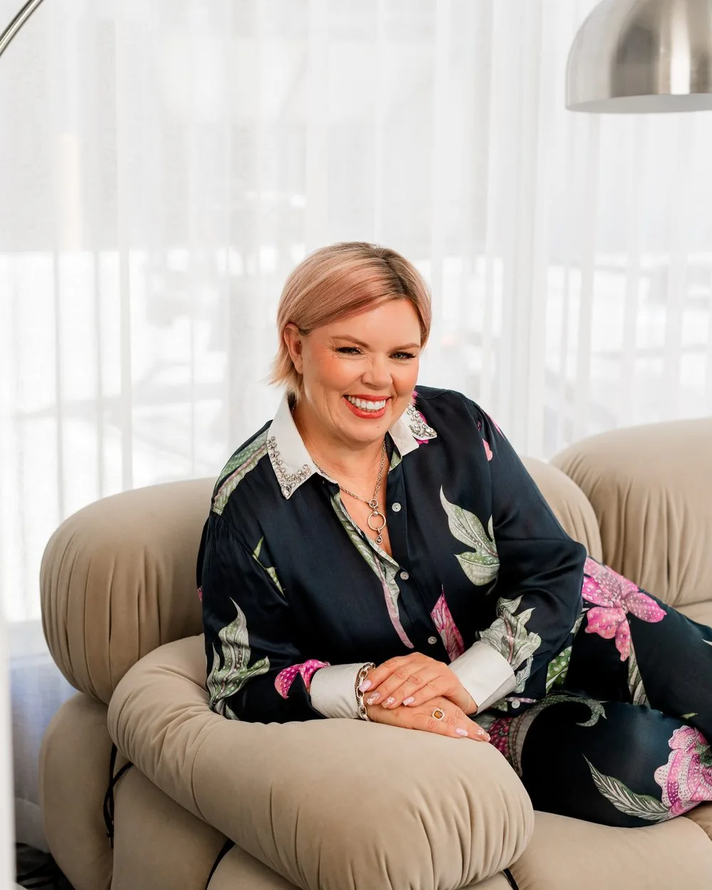 Catheryn Wright smiling in an armchair