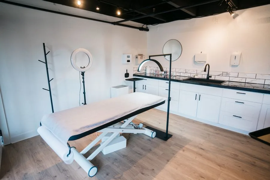Treatment room in a modern aesthetic clinic with a ring light