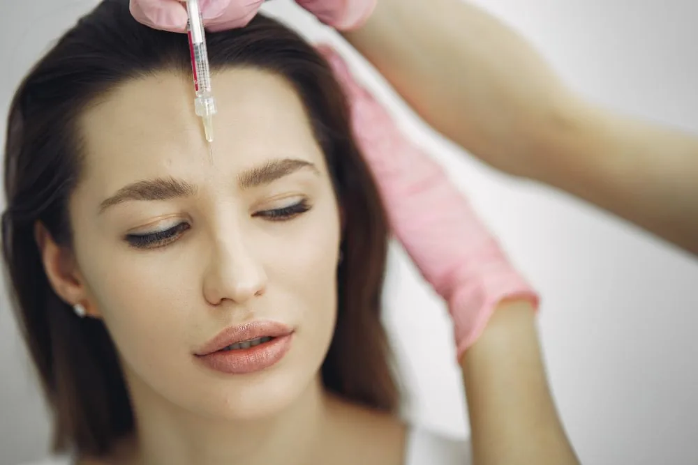 Practitioner performing a cosmetic injectable treatment