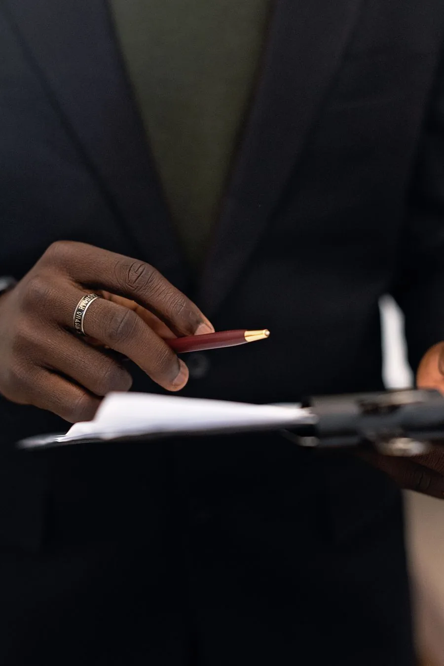 Business professional reviewing documents with a pen