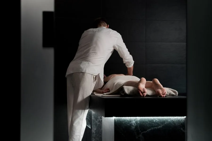 Therapist giving a massage at a wellness spa
